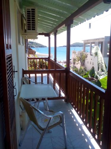 a balcony with chairs and a view of the ocean at Pansion Matoula in Skiathos Town