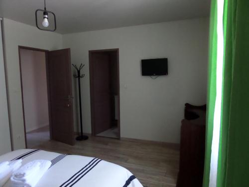 Ένα ή περισσότερα κρεβάτια σε δωμάτιο στο Chambre d'hotes ronquer
