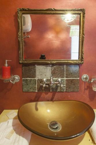 a bathroom with a sink and a mirror at Agriturismo Torre Flavia in Ladispoli