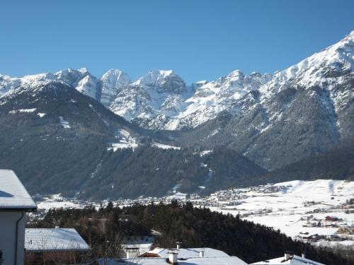 a view of a mountain range with snow covered mountains at Haus Gantioler in Mieders