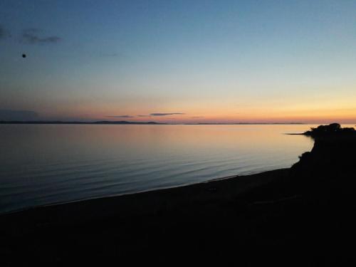 a sunset over a body of water at Josip in Nin