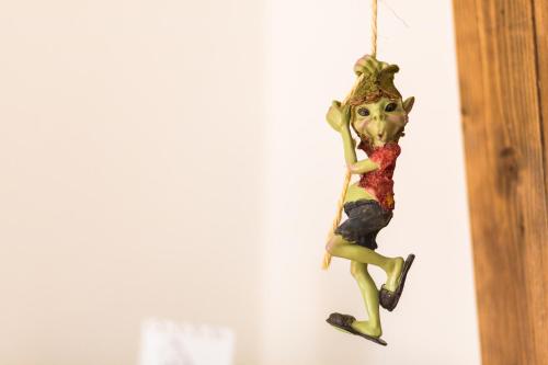 a figurine of a woman hanging on a wall at B&B Il Folletto del Lago in Stresa