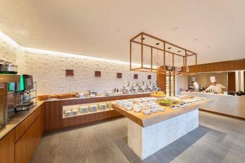 a kitchen with a table with food on it at Hyatt Regency Seragaki Island Okinawa in Onna