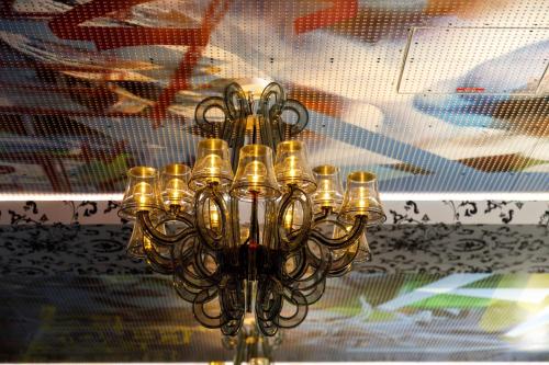 a chandelier hanging from a ceiling in a room at Youth Hostel Würzburg in Würzburg