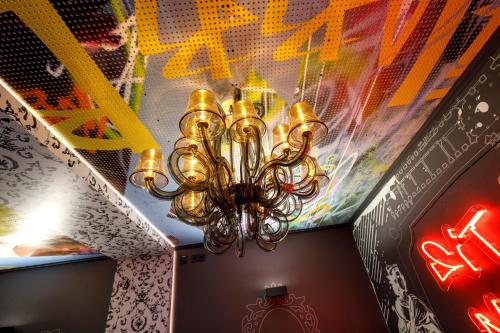 a chandelier hanging from a ceiling in a restaurant at Youth Hostel Würzburg in Würzburg