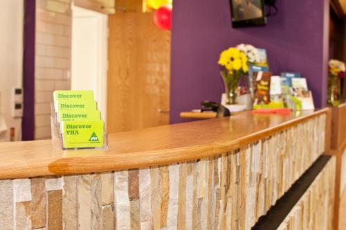 a counter in a store with a sign on it at YHA York in York