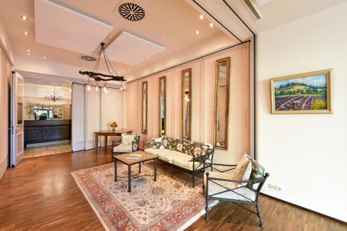 a living room with a couch and a table at Hotel Hirschen in Freiburg-Lehen in Freiburg im Breisgau