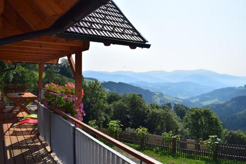 a balcony of a house with a view of mountains at Ferienhaus Schleinzer in Prebl