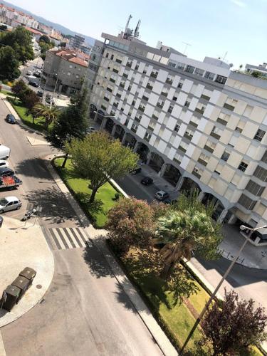 an aerial view of a large building with trees and a street at Alameda Residence in Tomar