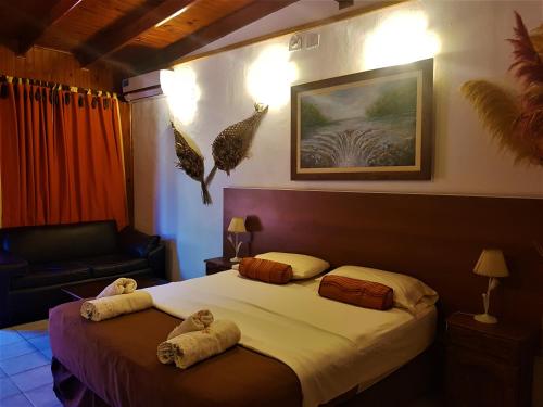 Cama o camas de una habitación en Si Mi Capitán - Cabañas & Habitaciones
