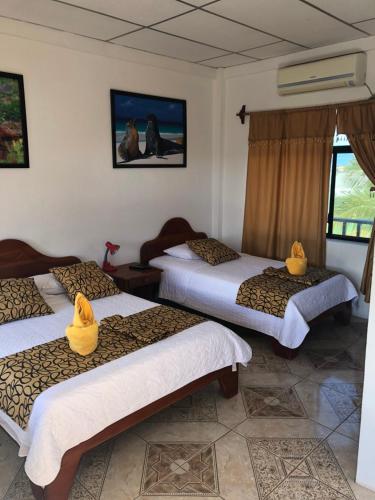 Postel nebo postele na pokoji v ubytování Hostal Sandrita