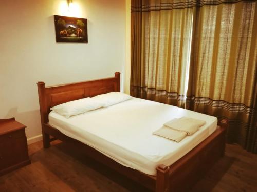 Katil atau katil-katil dalam bilik di Wishing Well Apartment