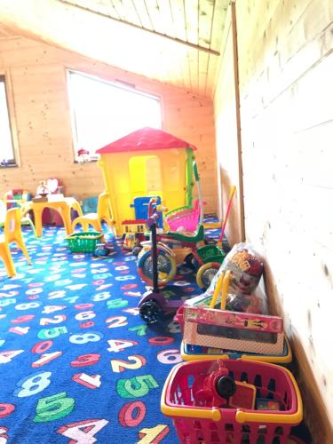 a play room with toys on the floor at Georgiy in Oryavchyk