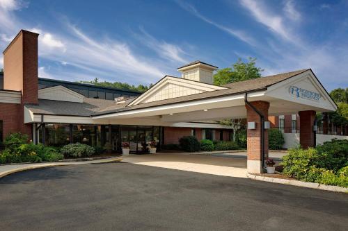 a building with a parking lot in front of it at Boxboro Regency in Boxborough