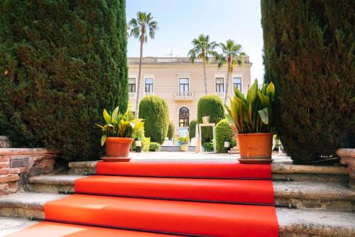 a set of red stairs in front of a building at Casa de los Bates in Motril