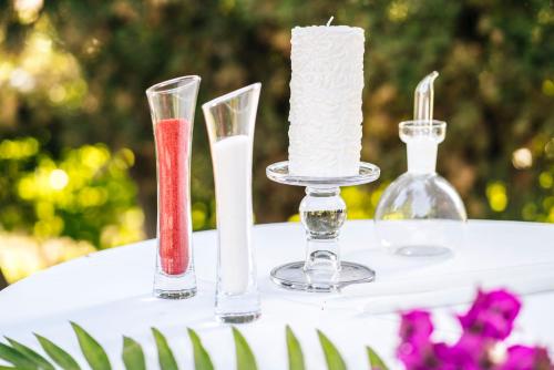 a table with three candles on top of a table at Casa de los Bates in Motril