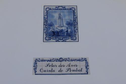 a blue and white picture with a sign on a wall at Solar dos Avós in Sabrosa