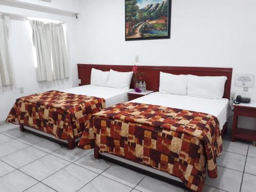 Cama o camas de una habitación en Hotel Hacienda de Zapata