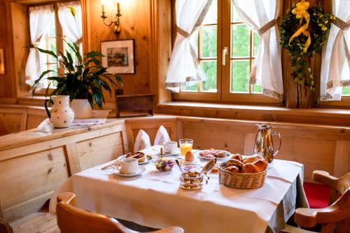 a table with a basket of bread on it at Landgasthof "Wilder Mann" in Innsbruck