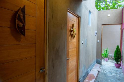 an open wooden door in a room with a door sidx sidx at Casa Boutique QX- Pachacamac in Pachacamac