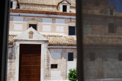 a building with a large door in front of it at El Patio del Limonero in Écija