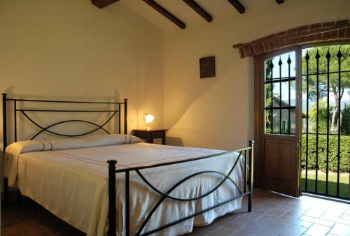 מיטה או מיטות בחדר ב-Agriturismo Podere Asciana