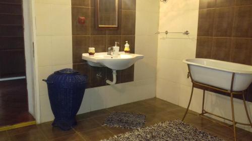 a bathroom with a sink and a bath tub at Mara in Zaječar