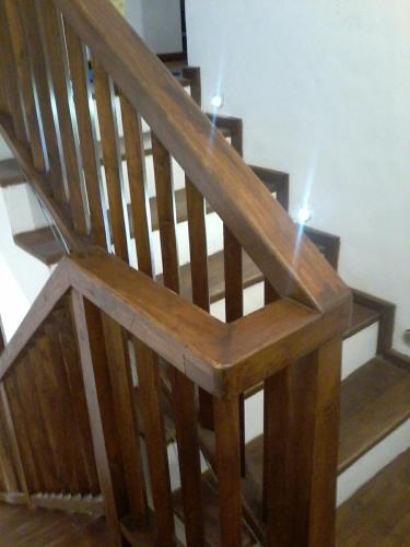 a wooden stair case with two candles on it at Secret Palace Guest house in Galle