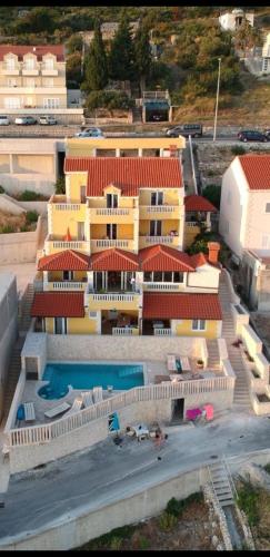 an aerial view of a building with a swimming pool at Villa Sunset in Mlini