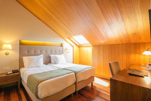 Katil atau katil-katil dalam bilik di Forte de São Francisco Hotel Chaves