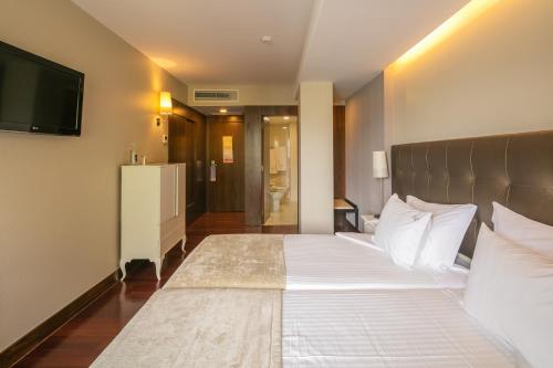 Katil atau katil-katil dalam bilik di Forte de São Francisco Hotel Chaves