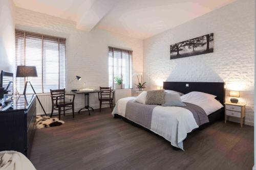 Katil atau katil-katil dalam bilik di B&B - Eetcafe - Riekelt