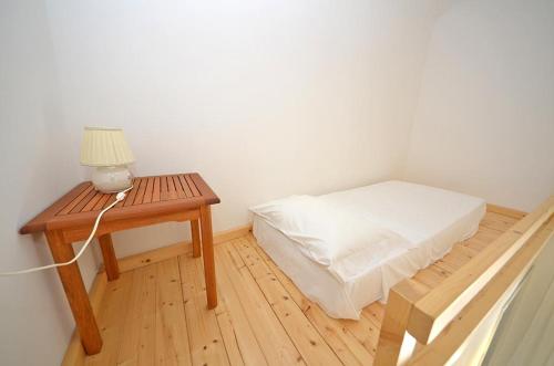 Ένα ή περισσότερα κρεβάτια σε δωμάτιο στο Casa Branca