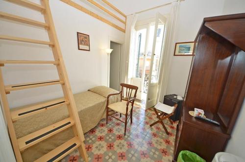 a bedroom with a bunk bed and a desk at Casa Branca in Castrignano del Capo
