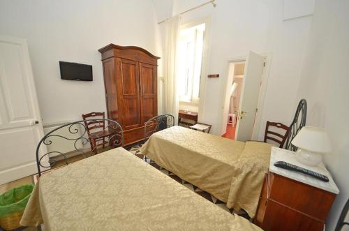 Ένα ή περισσότερα κρεβάτια σε δωμάτιο στο Casa Branca