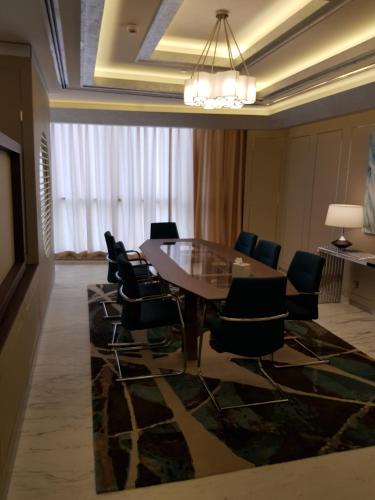 a conference room with a table and chairs at Royal M Hotel Abu Dhabi by Gewan in Abu Dhabi