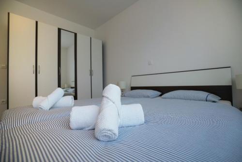 Posteľ alebo postele v izbe v ubytovaní Apartman Reno