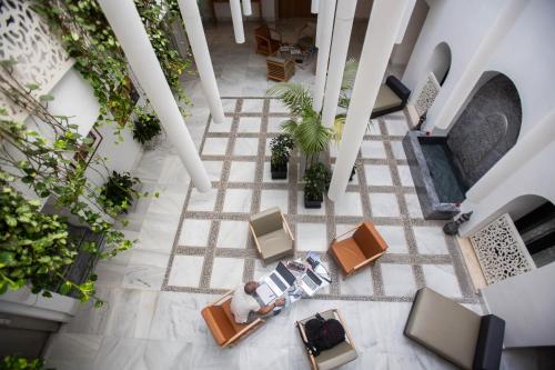 an overhead view of a lobby with tables and chairs at Soho Boutique Capuchinos & Spa in Córdoba