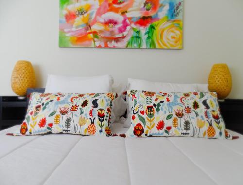 En eller flere senge i et værelse på RS Porto Vilar