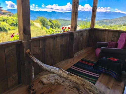 a living room with a view of the mountains at Dream house in Leshten