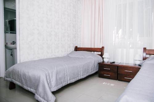 Postel nebo postele na pokoji v ubytování Hotel Dikanka