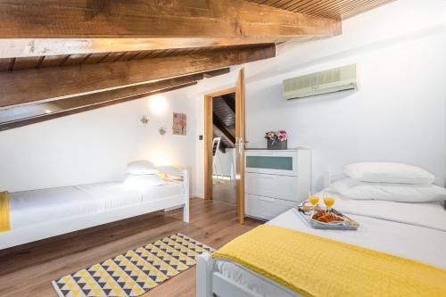 Postel nebo postele na pokoji v ubytování Villa Angeli