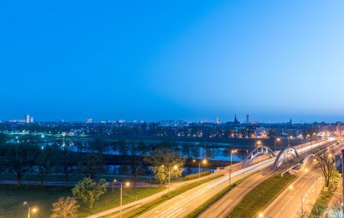 a view of a city at night with street lights at Weiser Hotel in Wrocław