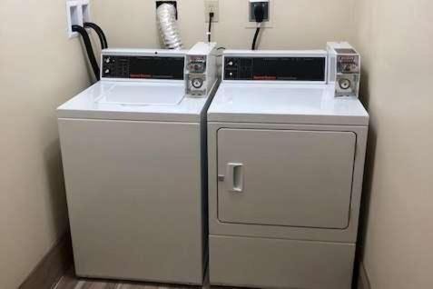 two machines are sitting next to each other in a room at Travelodge by Wyndham La Porte/Michigan City Area in LaPorte