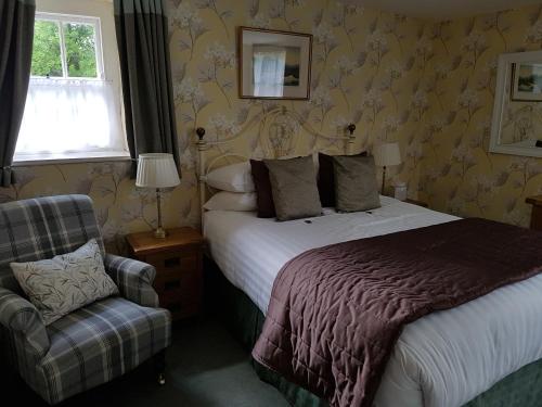 Cama o camas de una habitación en The Old Dungeon Ghyll Hotel