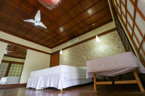 Katil atau katil-katil dalam bilik di Charme Hotel Guarujá Frente Mar