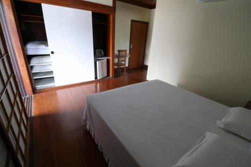 Katil atau katil-katil dalam bilik di Charme Hotel Guarujá Frente Mar