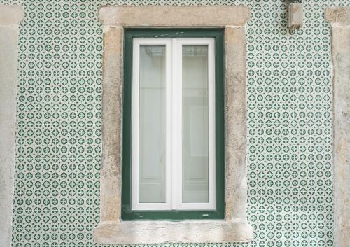 a window on the side of a building at Madragoa Studio Zero in Lisbon
