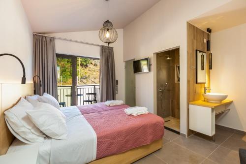 מיטה או מיטות בחדר ב-T Hotel Premium Suites