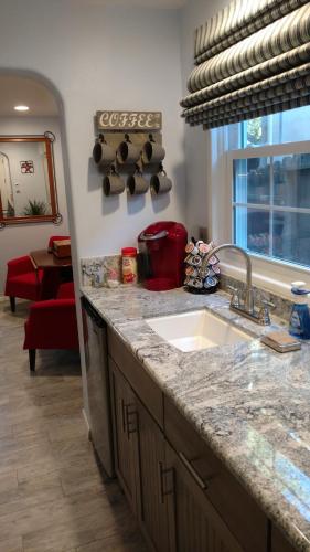 a kitchen with a sink and a counter top at Casa Tranquility in San Diego